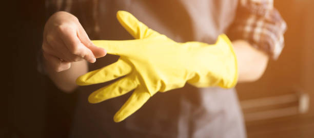 istock A woman in yellow rubber gloves does housework 1344001639