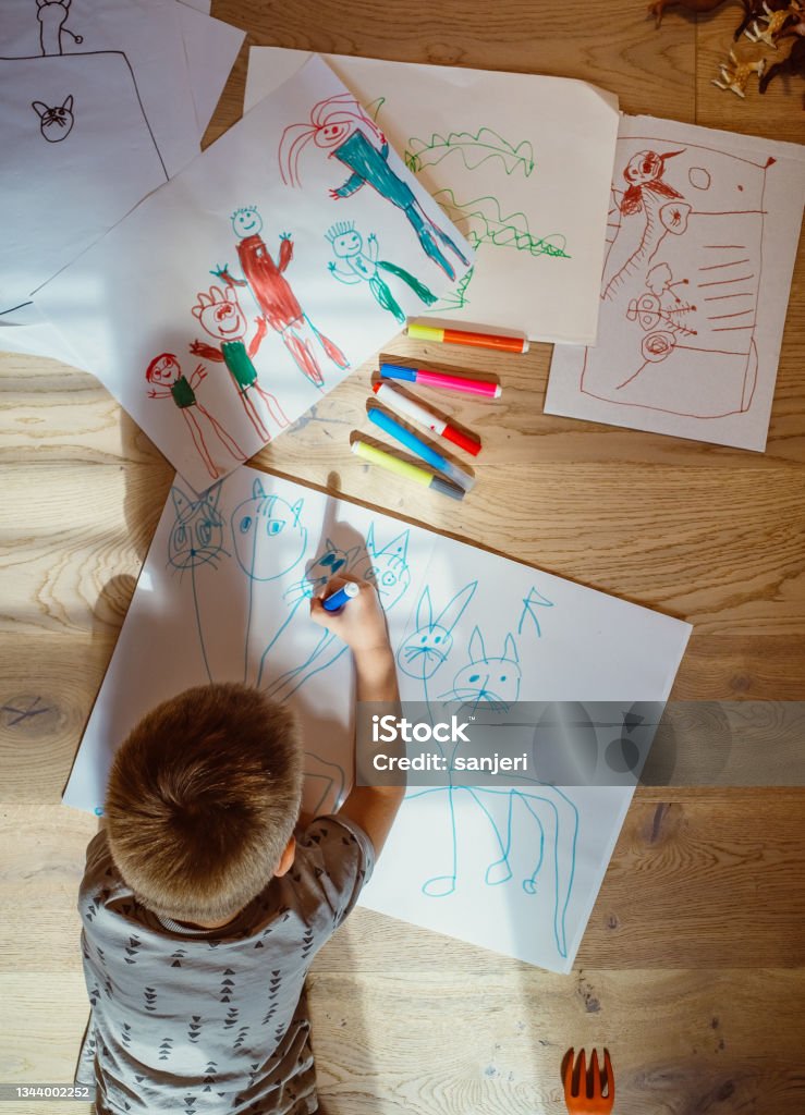 Kid Drawing On The Floor Stock Photo Download Image Now 45 Years