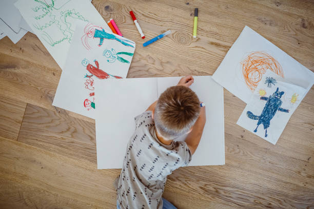 istock Kid drawing on the floor 1344002253
