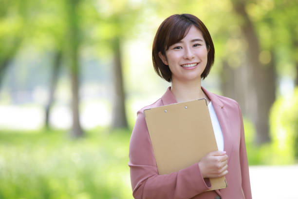 istock Female employee with binder 1344002896