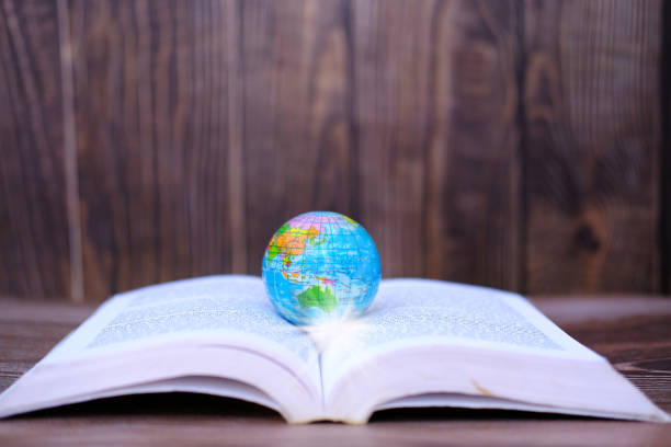 istock Earth on a book, brainstorming, inspiration and education concepts. 1344005939