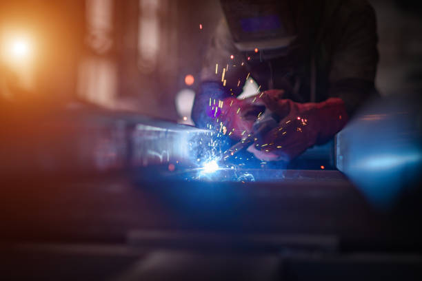 istock Worker cuts metal grinder. Sparks fly 1344007291
