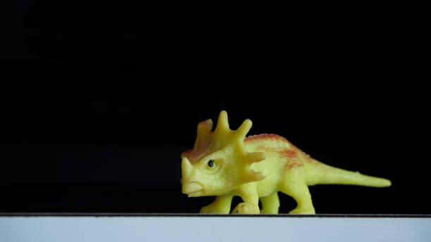 istock Styracosaurus dinosaurs action figure toy with black background 1344007491