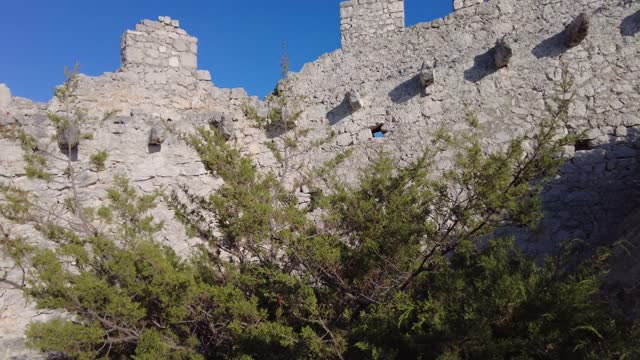Woman on Wall of Ostrica of Croatia