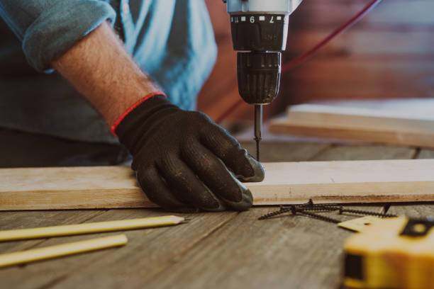 istock Close up of worker using electric scredriver on the table 1344010460