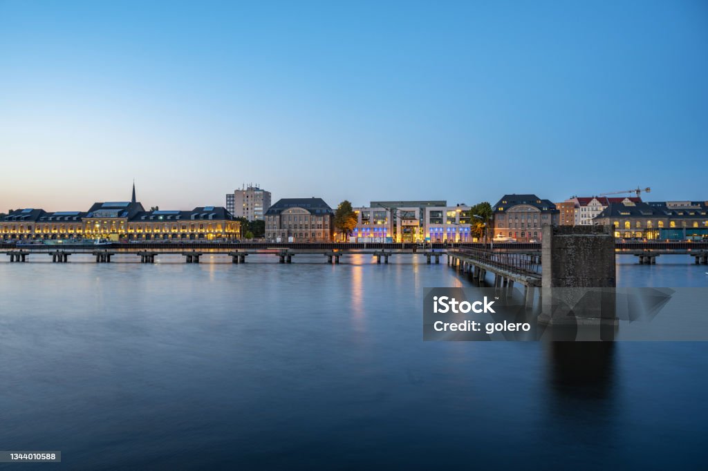 view from Kreuzberg on spree river and illuminated berlin cityscape at blue hour view on modern business and residential district at spree river in berlin at blue hour 2021 Stock Photo