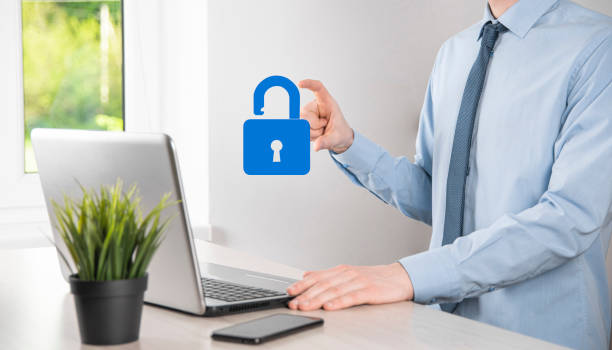 istock Male hand holding a lock padlock icon.Cyber security network. Internet technology networking.Protecting data personal information on tablet. Data protection privacy concept. GDPR. EU.Banner 1344010597