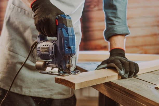 istock Close up of worker using electric jigsaw in the workshop 1344010602