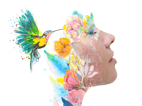 Soft and colorful paintography portrait of a young lady combined with a painting of a hummingbird