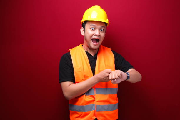 istock Happy Young asian man workers when see watch 1344011065