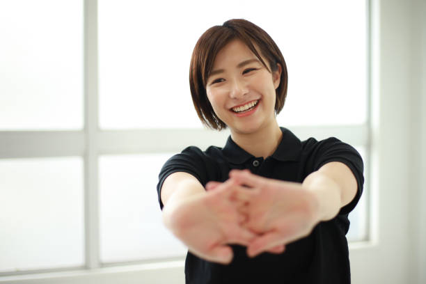 istock Image of a sports trainer that stretches 1344012211