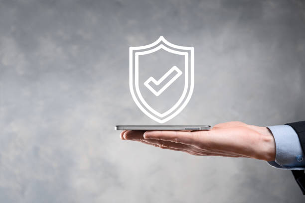 istock Protection network security computer in the hands of a businessman. business, technology, cyber security and internet concept - businessman pressing shield button on virtual screens Data protection 1344012373