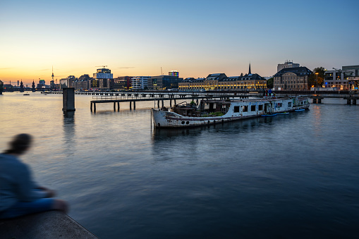 view on modern business and residential district at spree river in berlin at blue hour
