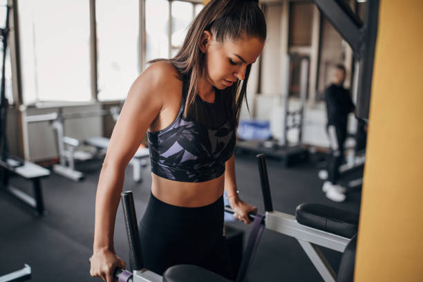 istock Beautiful woman exercising in gym 1344014962