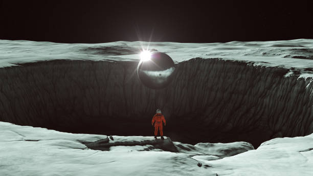 orange spaceman spacewoman with large alien silver sphere standing on the edge of a large crater on the moon with bright sun reflection sci fi astronaut cosmonaut moonscape - spacewoman imagens e fotografias de stock