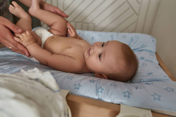 istock Newborn babycare concept. Side view young child on changing table 1344015495