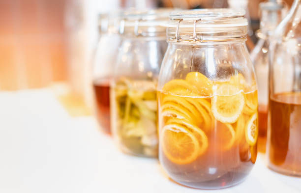 Homemade fermented raw kombucha tea with different flavorings, as a lemon organic probiotic drink. Healthy natural beverage and good for health. stock photo