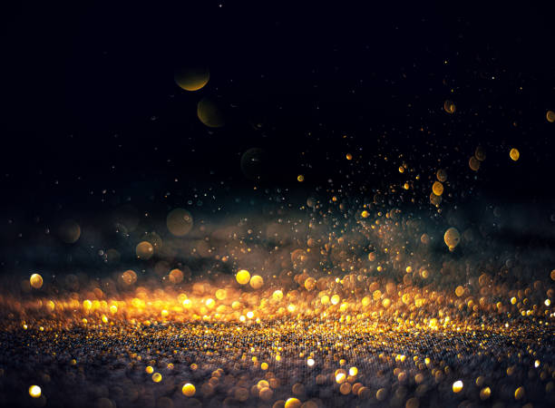 istock blurred glitter bombs, gold glitter defocused abstract Twinkly Lights grunge Background. 1344015874