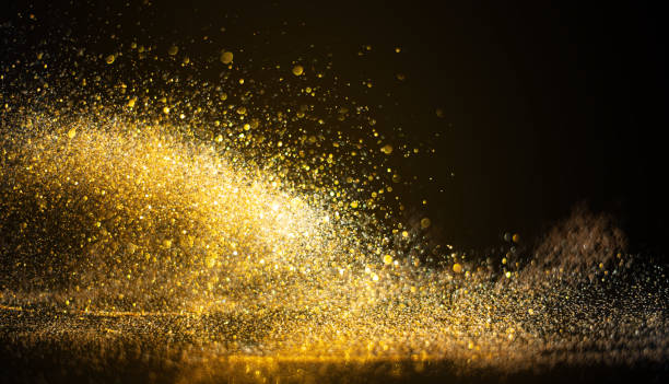 istock blurred glitter bombs, gold glitter defocused abstract Twinkly Lights grunge Background. 1344016428