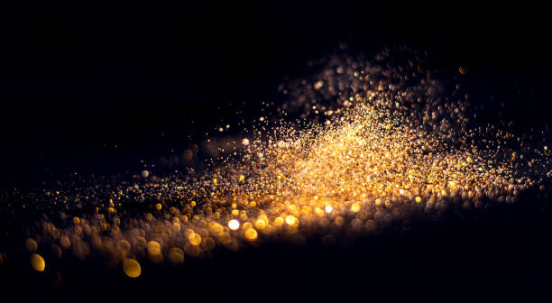istock blurred glitter bombs, gold glitter defocused abstract Twinkly Lights grunge Background. 1344016438