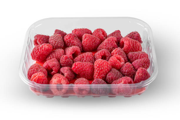 istock ripe red raspberries in a plastic box isolated on a white background 1344017565