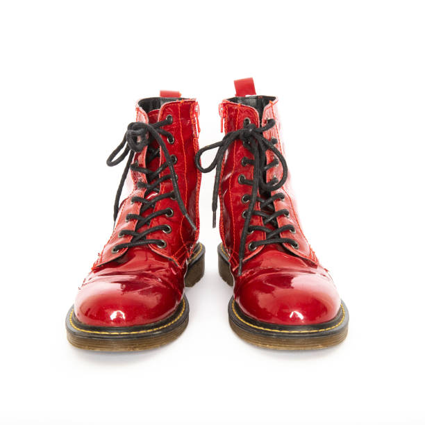 Red boots isolated on white Pair of old red boots isolated on white background red boot stock pictures, royalty-free photos & images
