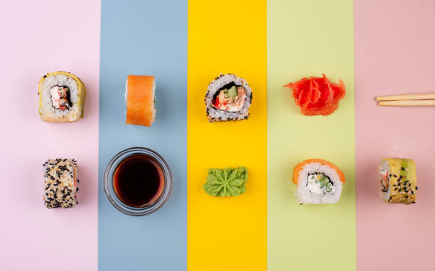 istock Japanese sushi rolls on color background 1344021381