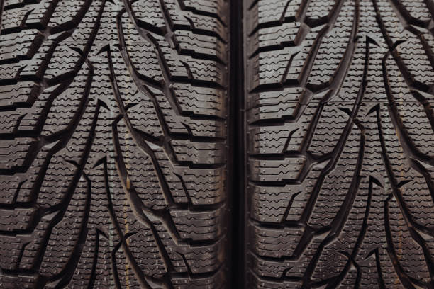 istock Protector of new car tyres in a shop 1344025632