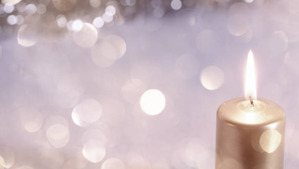 istock Christmas still card or background.  Copy space with lit candle 1344026362