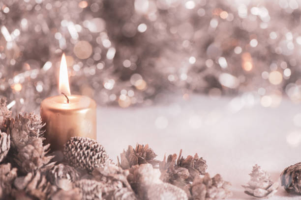 istock Christmas still card or background.  Copy space with lit candle 1344026959
