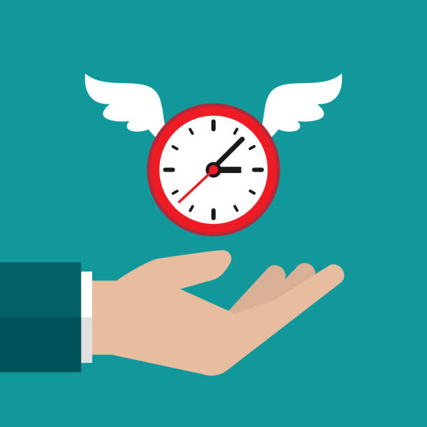 istock Businessman hand catches flying clock with wings. Hunt, chase time. Achieve goals, financial success, business income concept. 1344027220