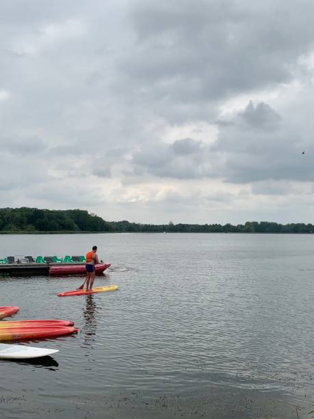 istock Paddle boarding on a cold French lake. 1344027431