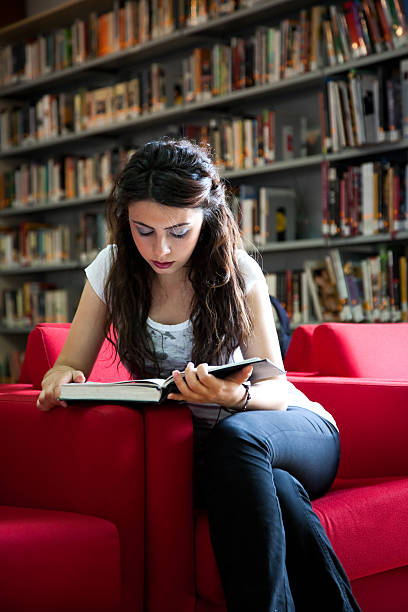 istock beautiful girl reading book 134402779