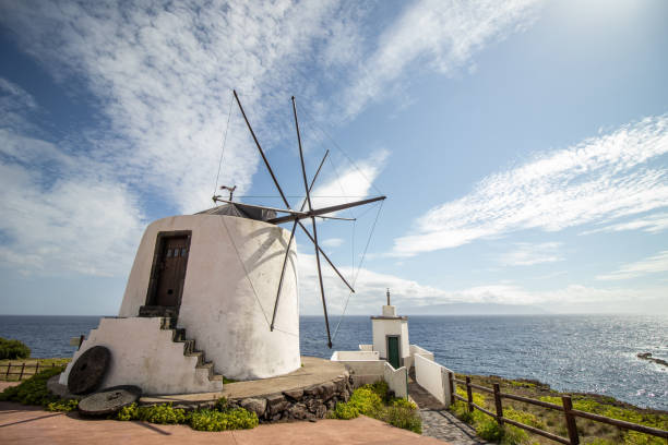 Azores windmill, at Corvo island, by the Atlantic ocean, good weather. stock photo