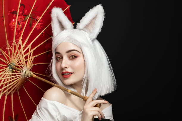 Girl in white wig and carnival costume, cosplay cat woman. Girl in white wig and carnival costume, cosplay cat woman. cosplay stock pictures, royalty-free photos & images