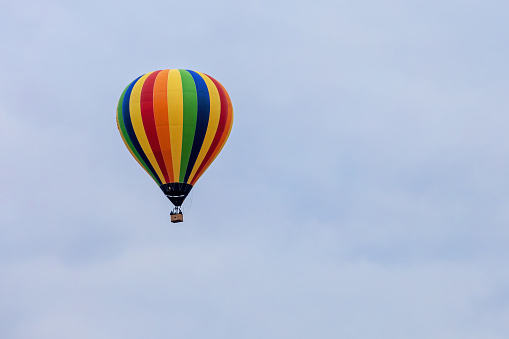 Colorful hot air balloon and blue sky in early evening