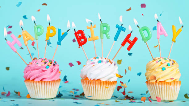istock Colored confetti falling with happy birthday inscription on pastel blue background 1344031700