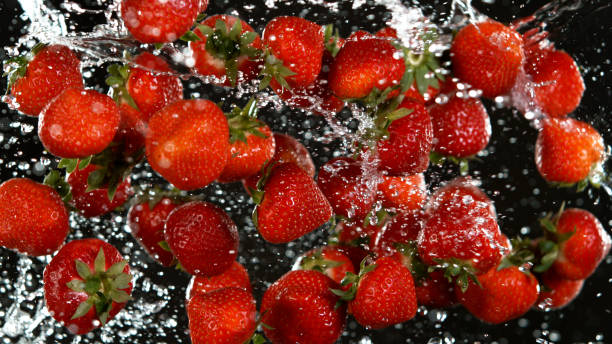 istock Fresh strawberries flying in the air. 1344032376