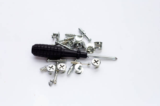 istock Hand screwdriver and screws on white background. 1344033286