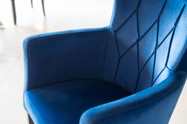 istock Stylish blue chair, close up. Textile chair 1344034848