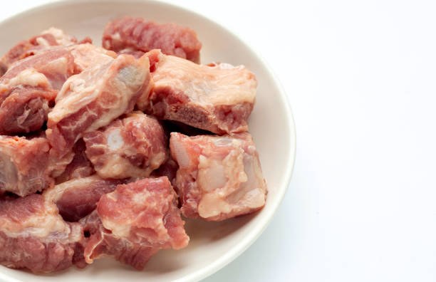 istock Raw pork ribs in white plate on white background. 1344034942