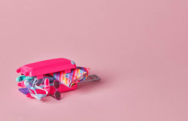 istock Pink suitcase full with toys 1344036280