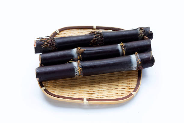 istock Sugar cane in bamboo basket on white background. 1344036578