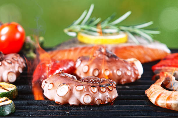 istock Assorted delicious grilled octopus tentacles with vegetables. 1344037102
