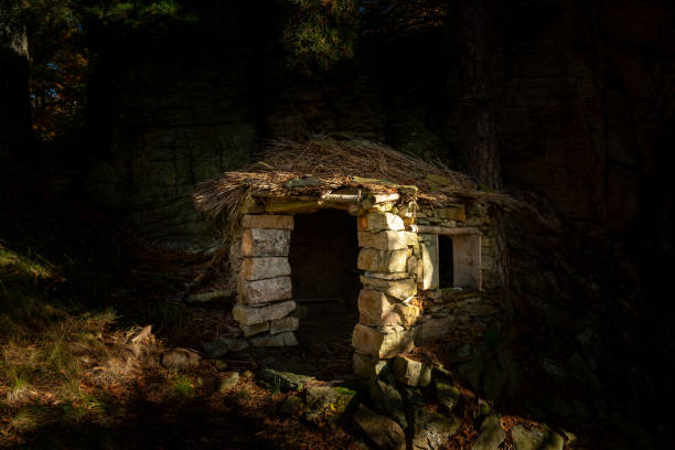 istock Small stone hut in the middle of a forest 1344037119