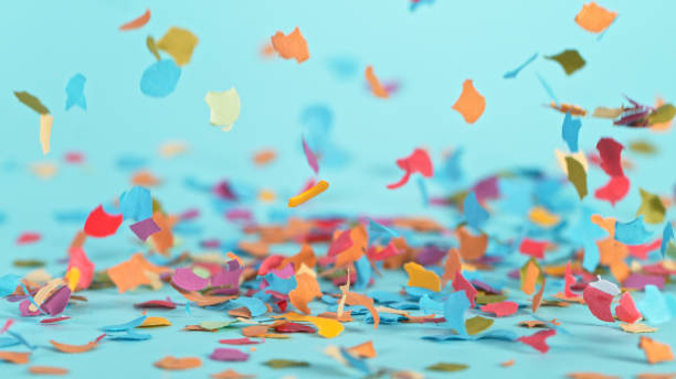 istock Color confetti falling on pastel blue background 1344037959