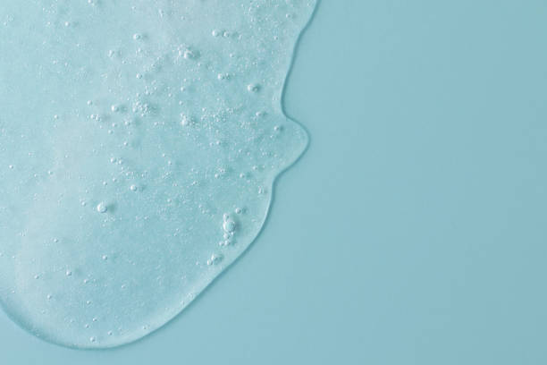 istock Background from cosmetic gel with bubbles,dripping down.Light blue color,copy space for text or design.Top view,antibacterial liquid surface.Good as background or mockup. 1344039770