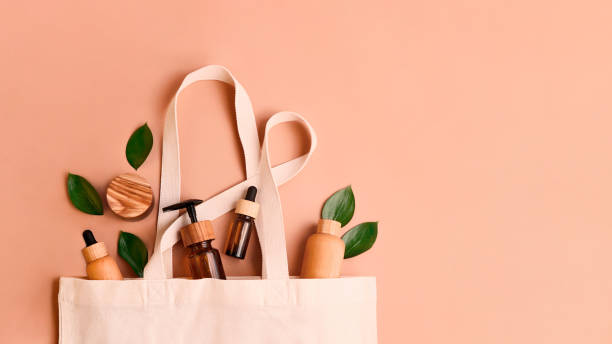 istock Open eco friendly cotton reusable bag with the different containers.Pastel colors.Fresh natural leafs around.Concept of organic,zero waste cosmetics.Woman bag with accessories,large banner. 1344039793