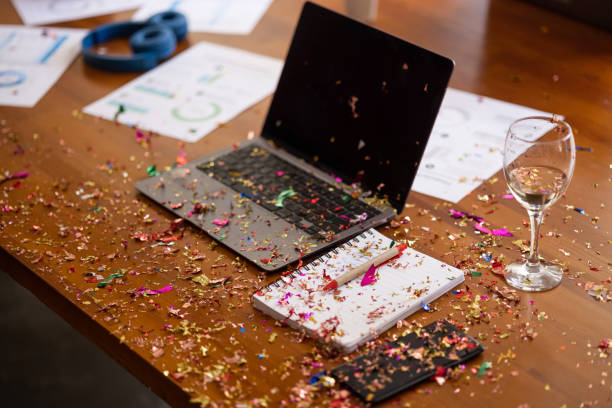 Broom cleaning confetti after new year's office party New year's eve office party, mess after the party, no people messy vs clean desk stock pictures, royalty-free photos & images
