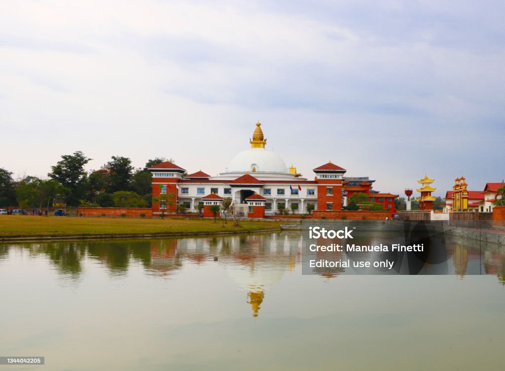 Buddhist temples in Lumbini (Nepal) The photo shows a few of the many buddhist temples constructed in the religious site of Lumbini, Bhudda’s birthplace (in Nepal, at the border with India). Lumbini - Nepal Stock Photo